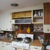 Removed the doors above the stove and rebuilt the cabinet to the right (1/19)