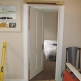 New door on the bedroom. Also note the built in cabinet and its painted trim.