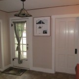 Re-painted the built in shelving. Stained the trim too.