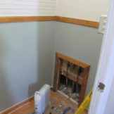 Put in a small door for plumbing