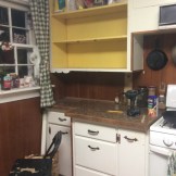 Took off the doors, then the lower shelf