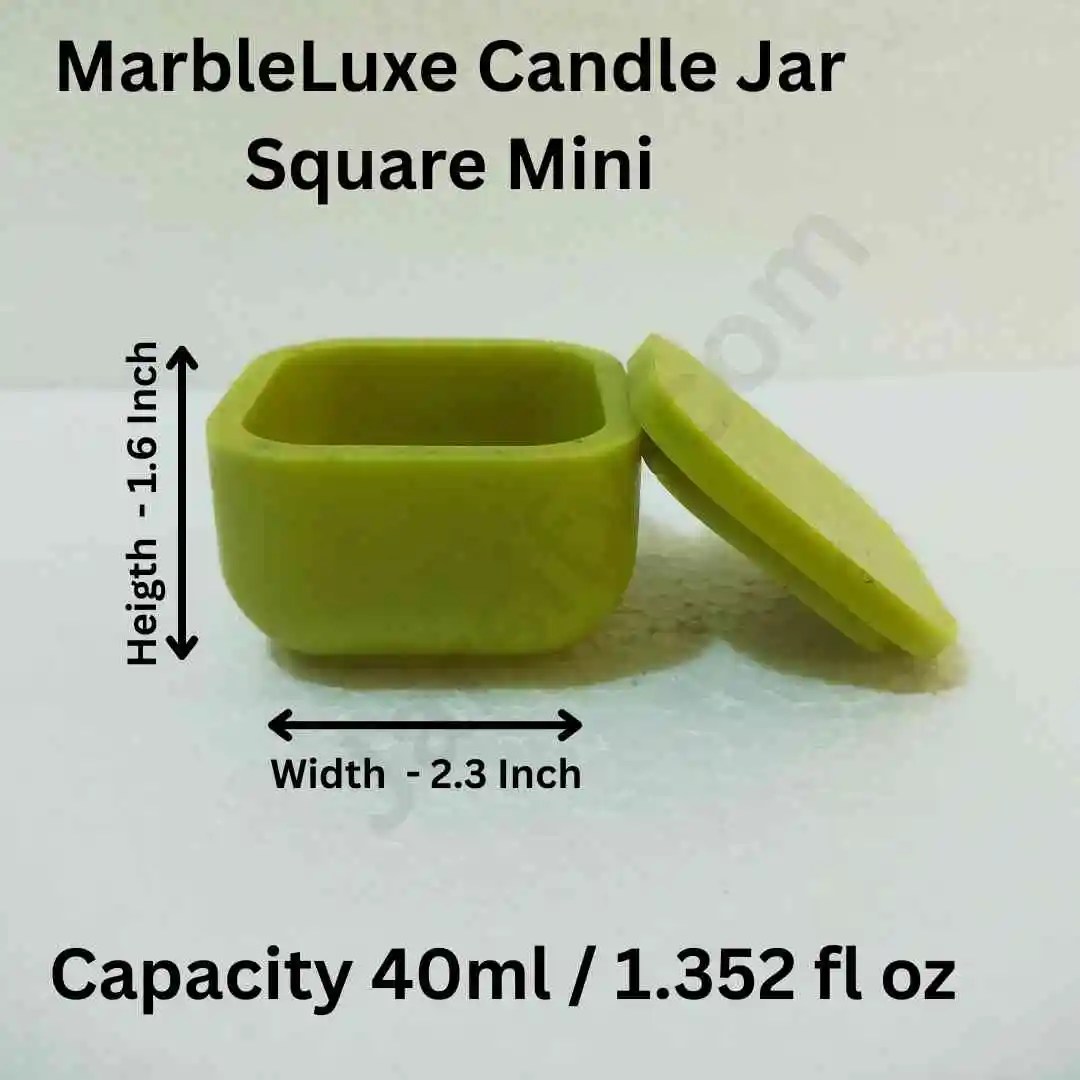 A small, square, clear glass jar with sharp edges on a minimalist surface.