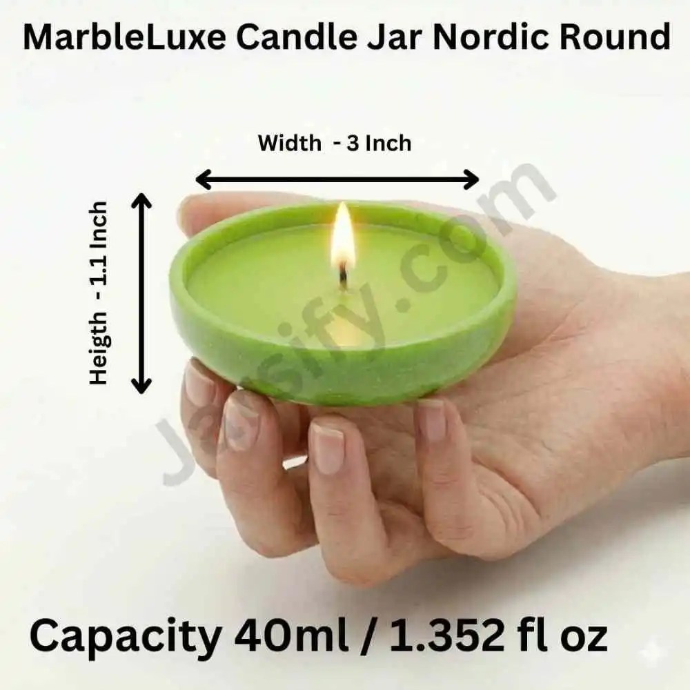 A person’s hand holding a shallow, lime green Nordic Round candle jar made from solid marble powder, featuring a wide circular design and a lit candle flame graphic.