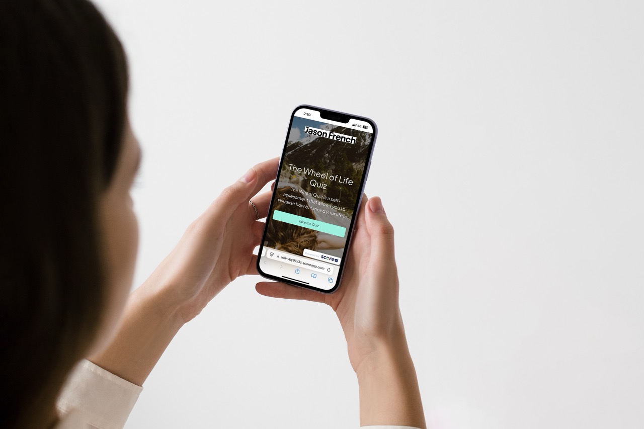 Girl on phone looking at wheel of life e-scorecard