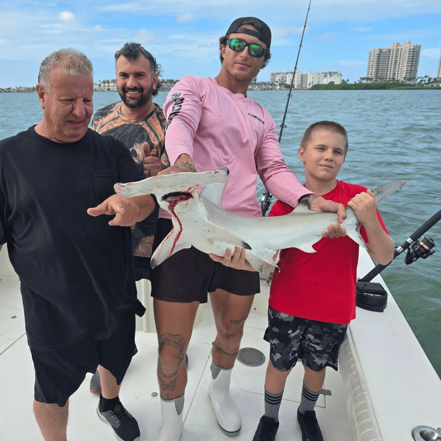 Captain David with a hammerhead shark on an Indian Rocks Beach fishing charter