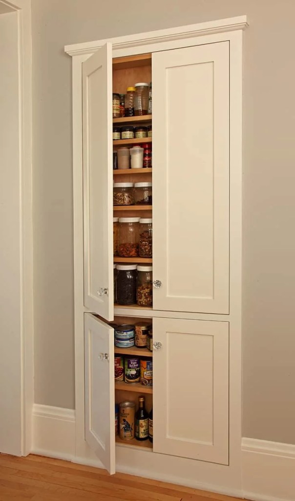 Compact pantry created with a between studs cabinet.