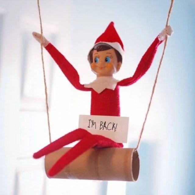 Elf On The Shelf swinging on toilet roll