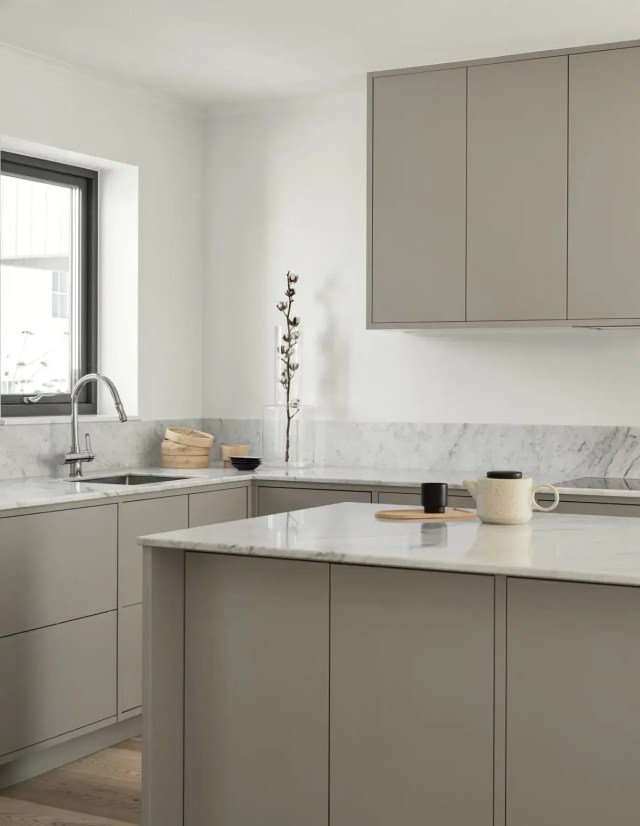 Statement vase on the kitchen counter, offering simple, beautiful things as impactful home styling decor.