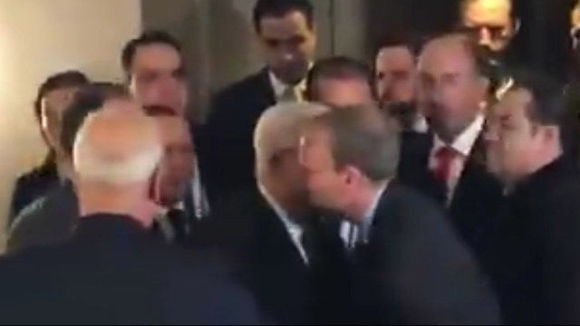 J Street’s director embraces Mahmoud Abbas as Saeb Erekat watches.