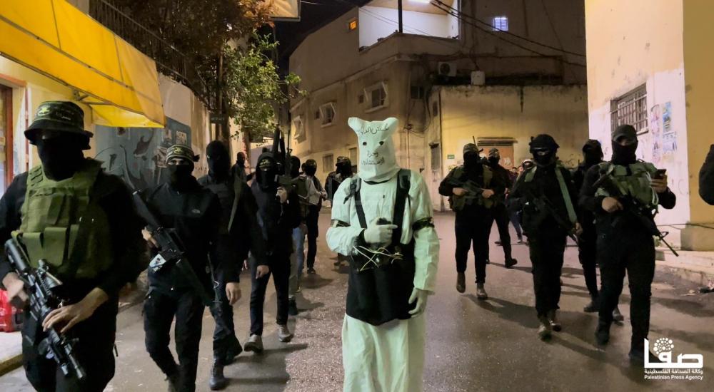 A show of strength by the Jenin Battalion. The man in white is wearing a martyr’s suicide vest