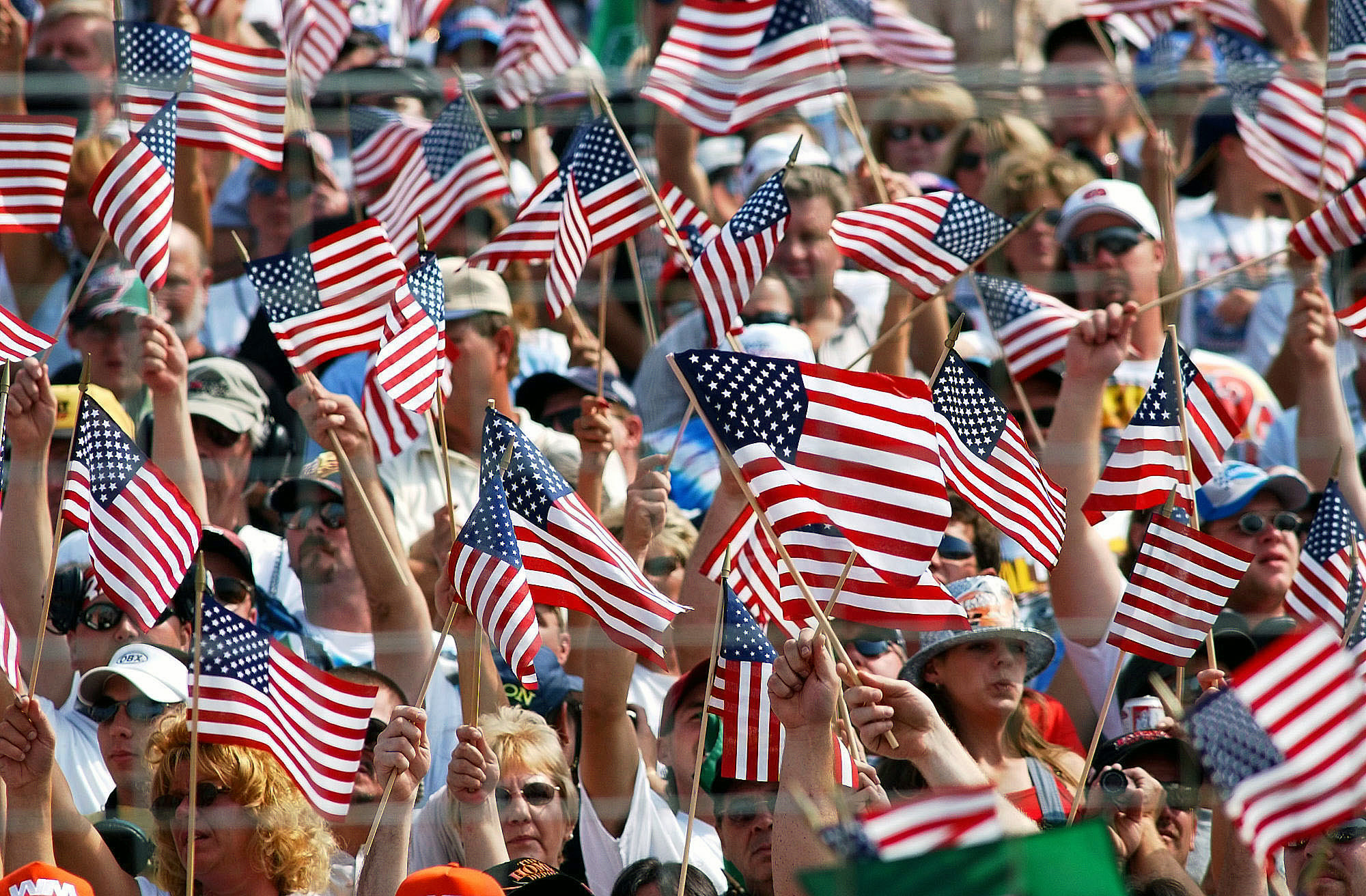 Americans wave flags