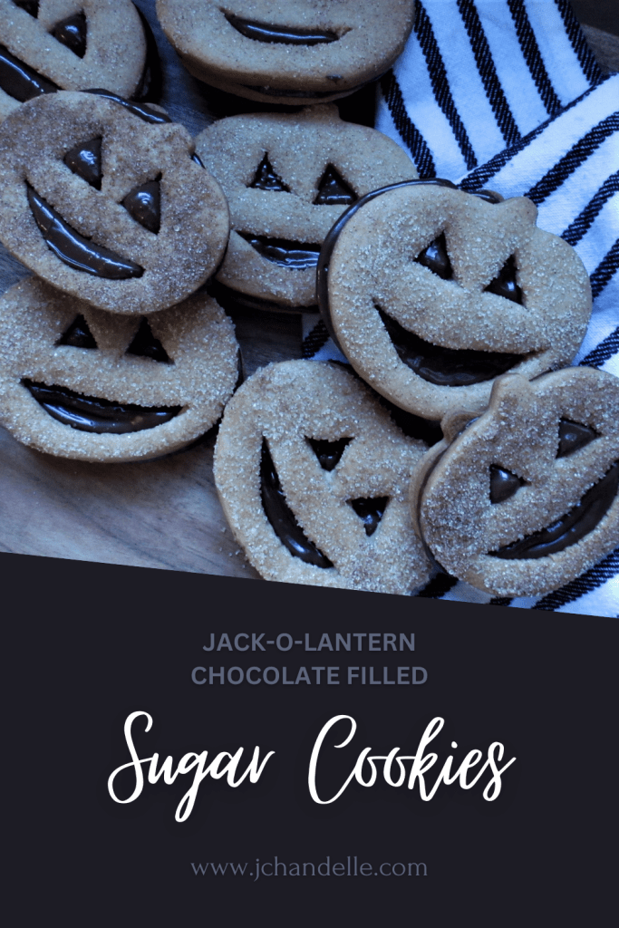 chocolate filled cinnamon sugar cookies in the shape of a pumpkin