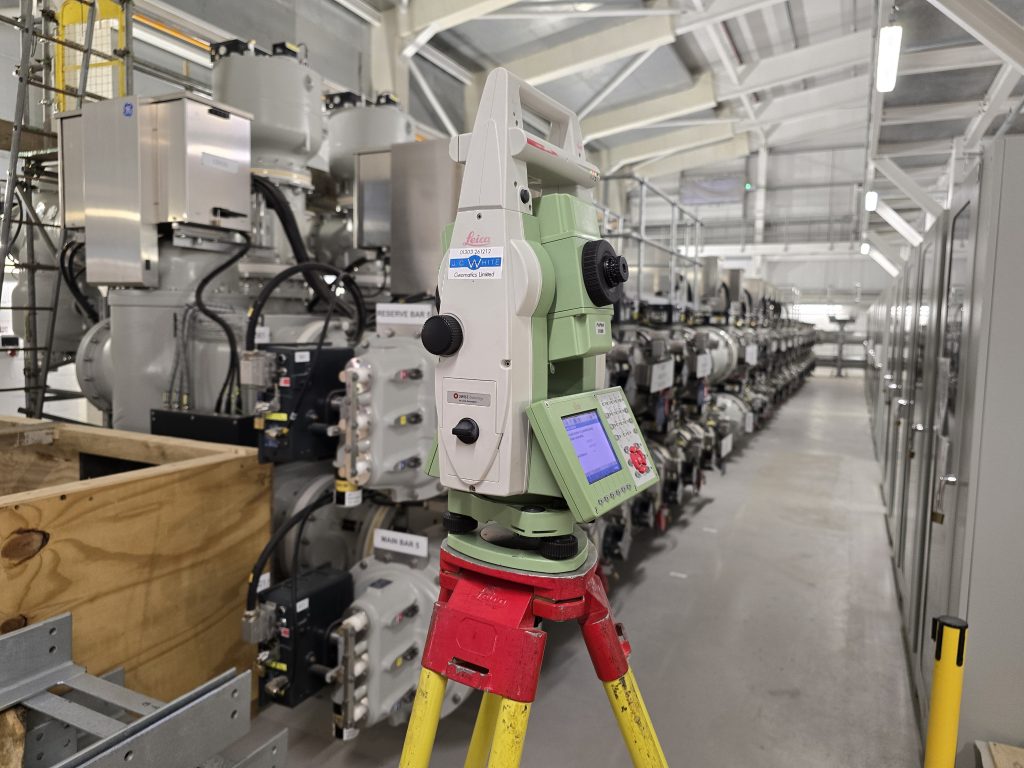 leica total station in front of electrical infrastructure