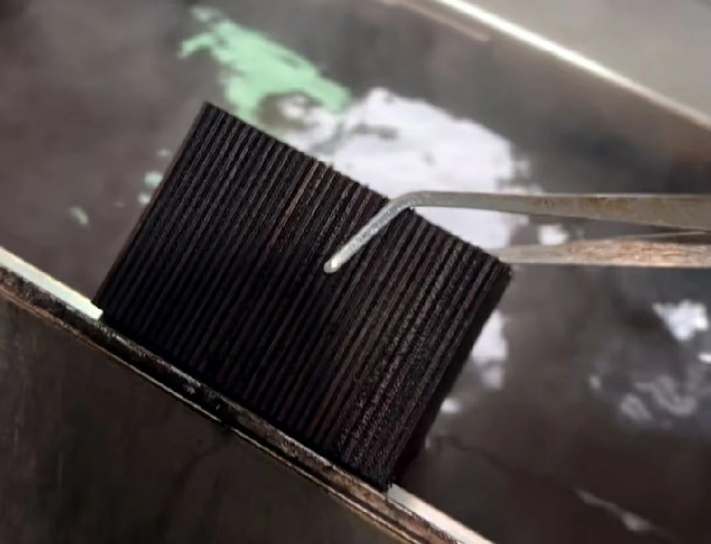 A plywood sample boiled until blackened shows no signs of delamination.