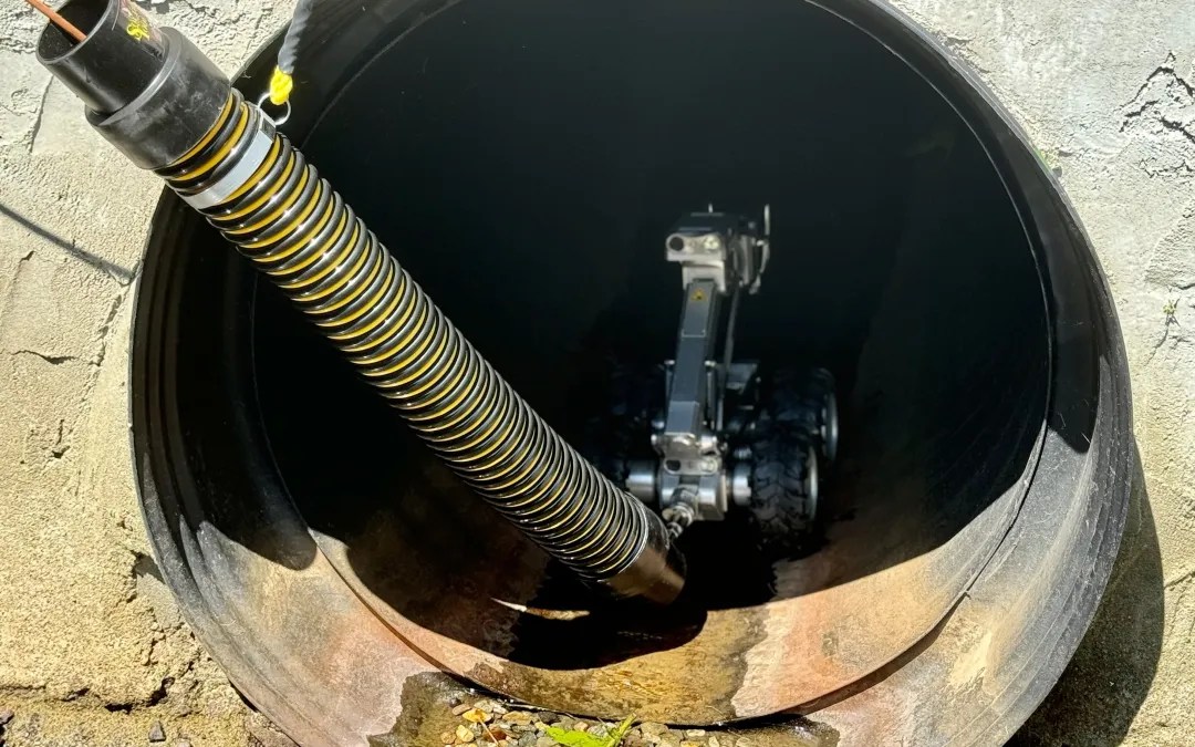 CCTV pipe inspection robot scanning commercial pipeline for blockages