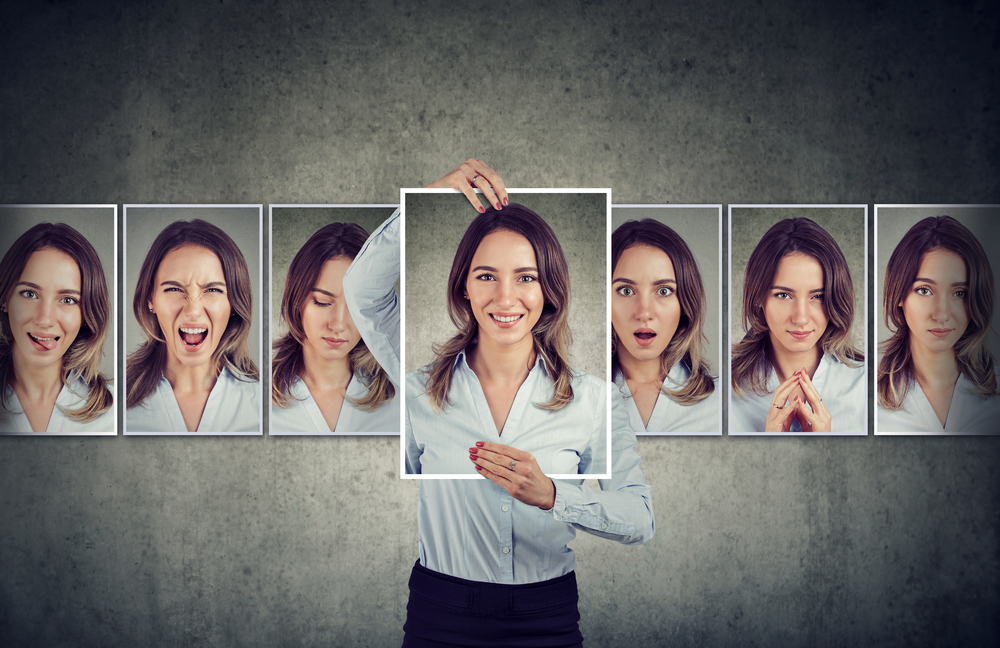 Young masked woman expressing different emotions