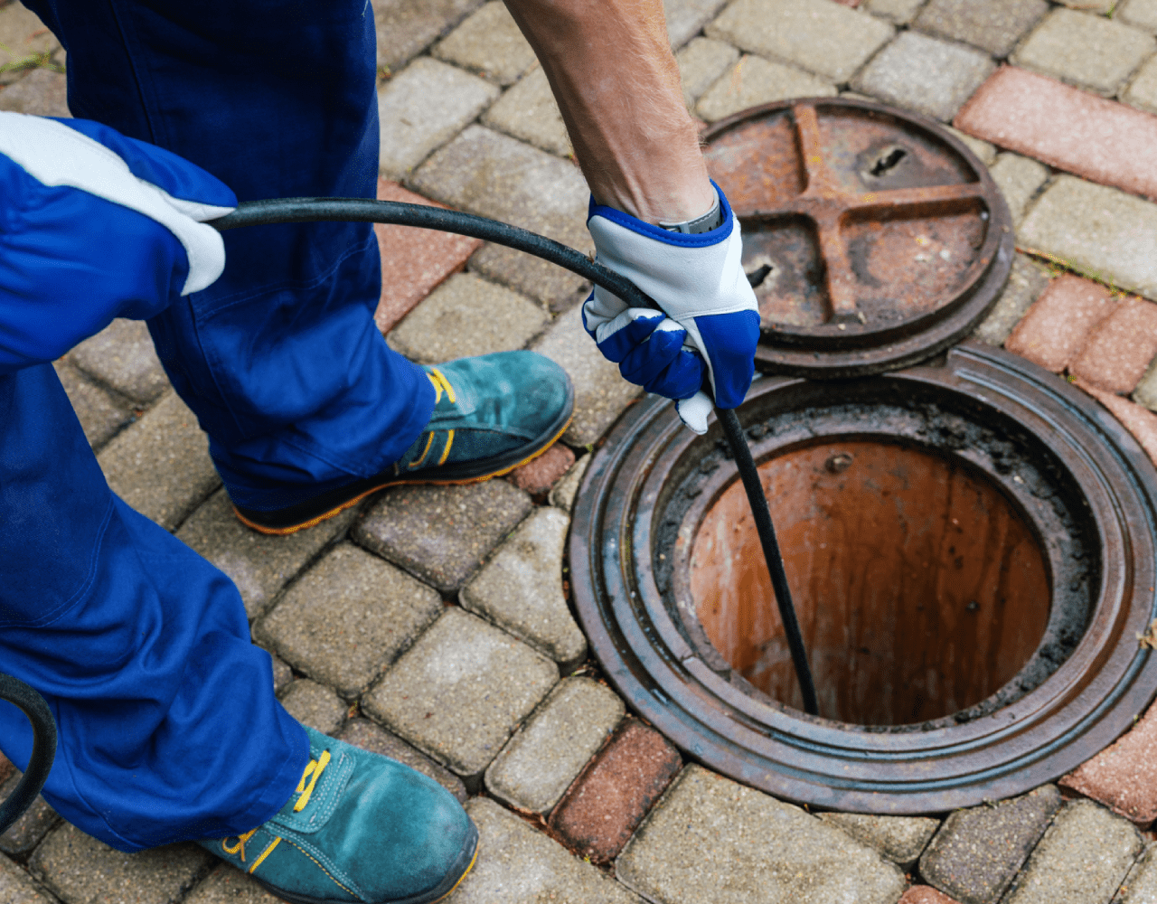High-pressure hydro jetting service being used to clear stubborn clogs in a New Jersey home's drain system, ensuring efficient water flow.