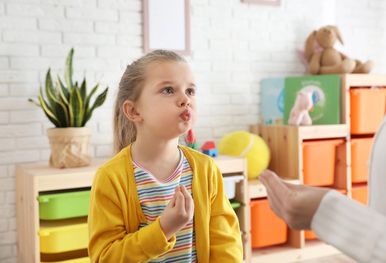 child receiving speech therapy