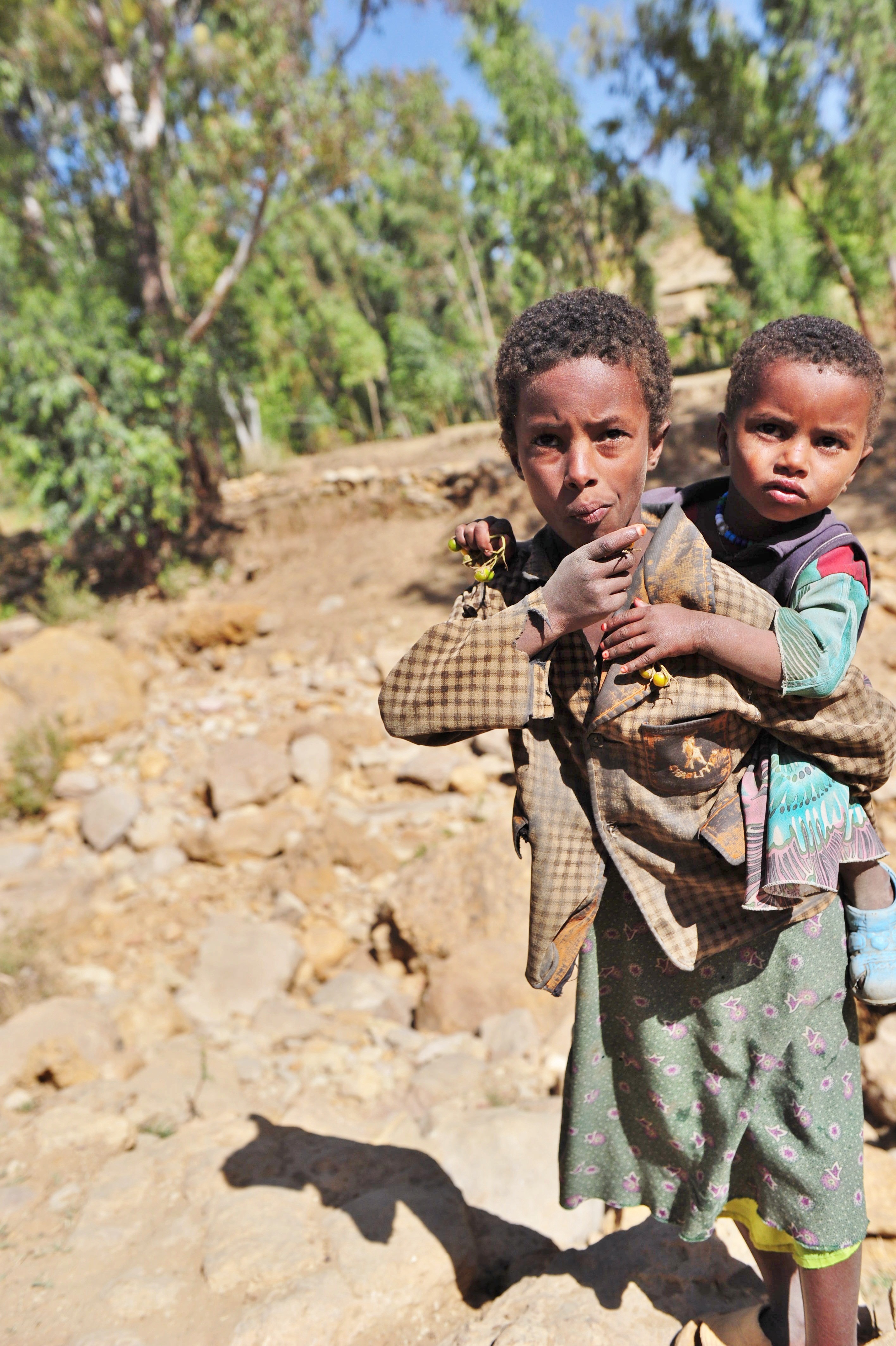 Two children pointing the way