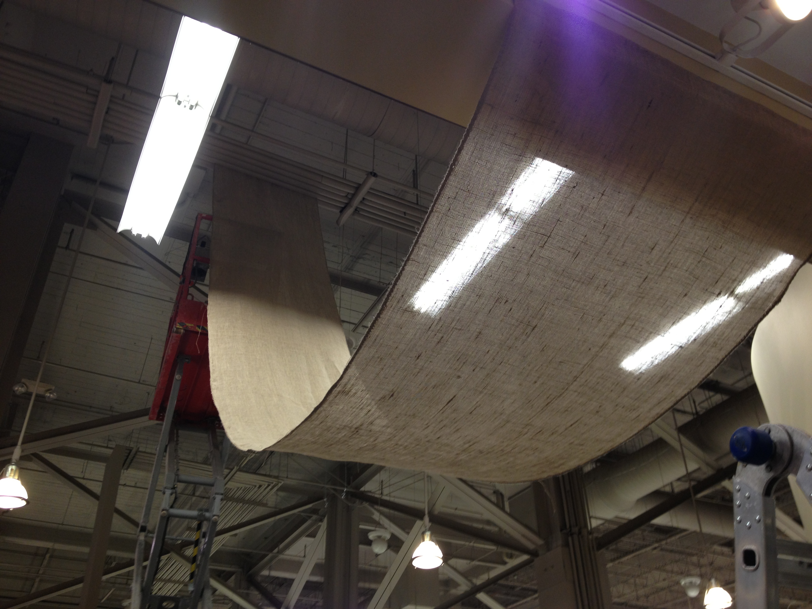we draped burlap from the ceiling to hang over our meat department.