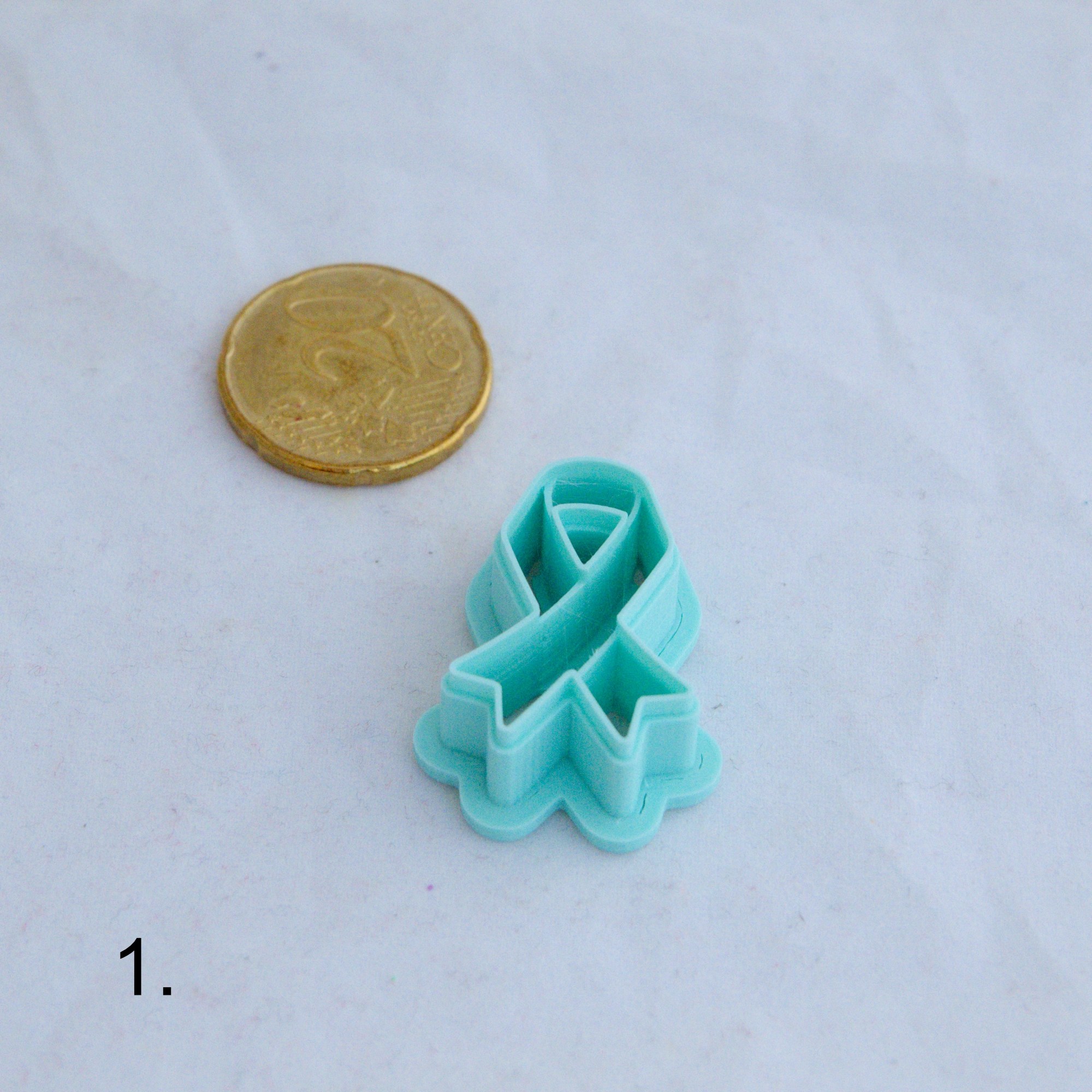 Tietoisuus- / tukinauhaleikkuri