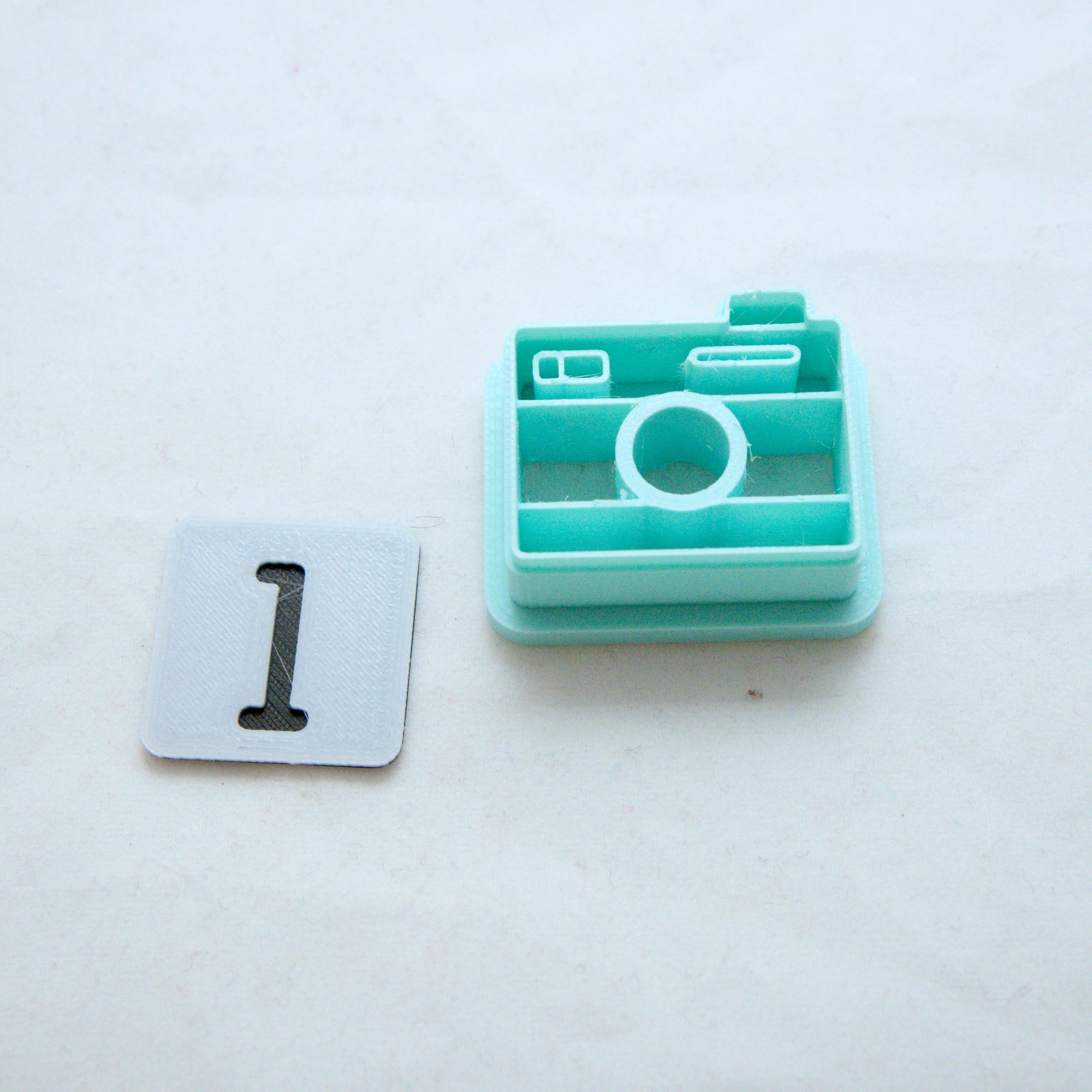 Kamera askartelumassaleikkuri