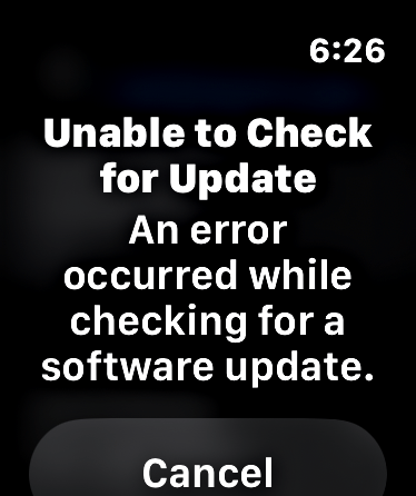 A close-up view of the Apple Watch Series 11 circular display, which is dark. Centered on the screen is a small error dialog box with light text reading, “Unable to Check for Update. An error occurred while checking for a software update.” Below the text, there is a prominent “Canel” button.