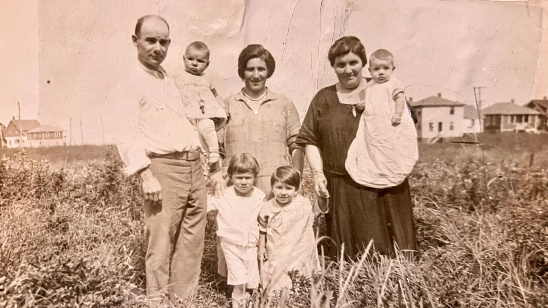 A black and white family portrait from the 1940s