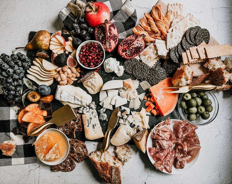how to make the ultimate fall inspired grazing board, plus what is a grazing board and the difference between snacking boards and charcuterie boards. Cheese pairings, crackers, spreads, cured meat recommendations, cheese recommendations, and more!