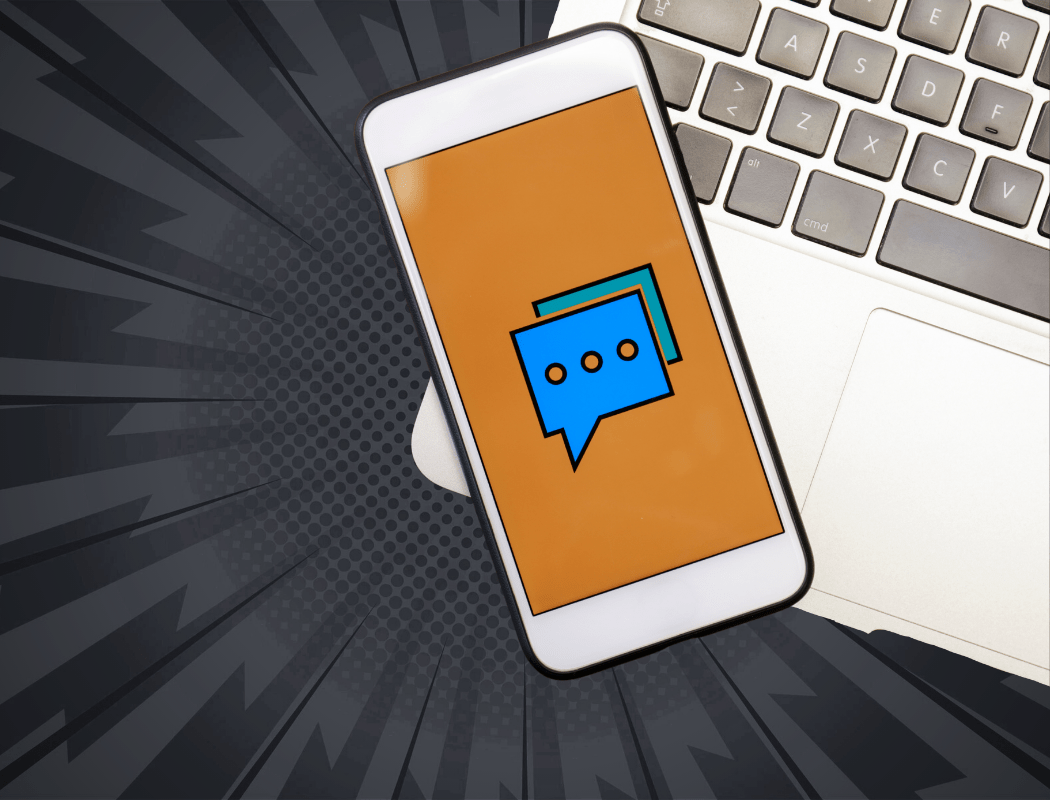 mobile device on top of a laptop