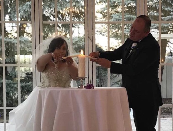 Chicago Wedding at Chateau Bu-Sche in Chicago, Illinois bride and groom candle lighting