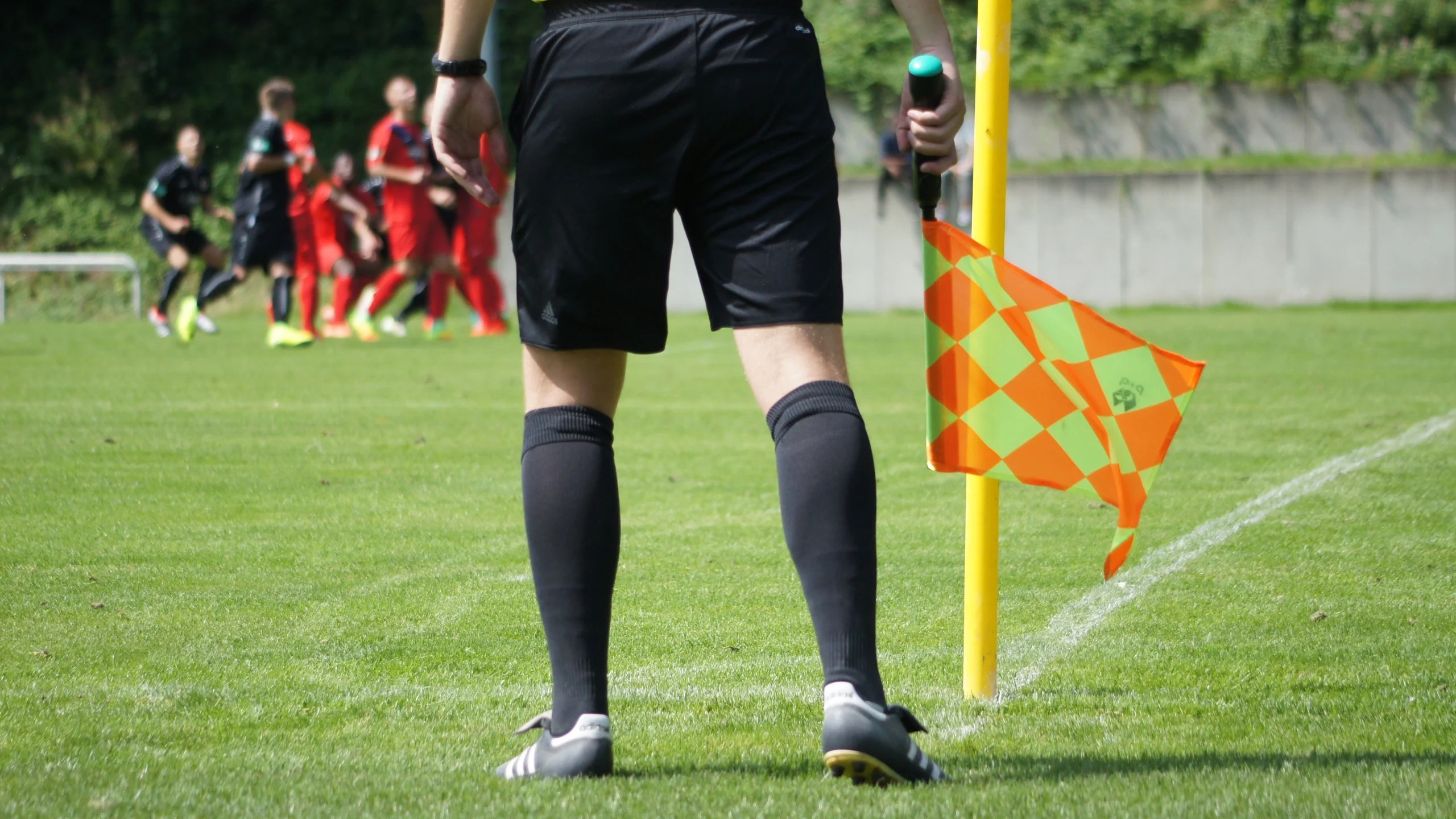 A linesman on a pitch.