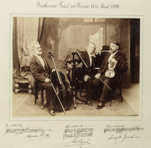 Portrait of Alfredo Piatti, Carl Reinecke and Joseph Joachim with musical quotations. Beethoven Feier in Bonn, 11-15 Mai 1890. Sepia photograph.