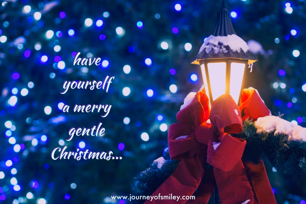 Christmas lights and a lantern with a red bow and on the left from the image is written have yourself a merry gentle Christmas on the Journeyofsmiley blog