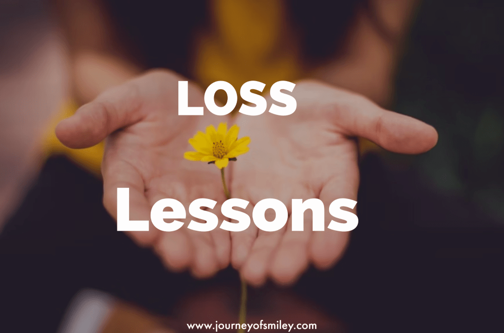 Two hands holding a yellow flower with the palms up and the title is Loss Lessons on the Journeyofsmiley blog