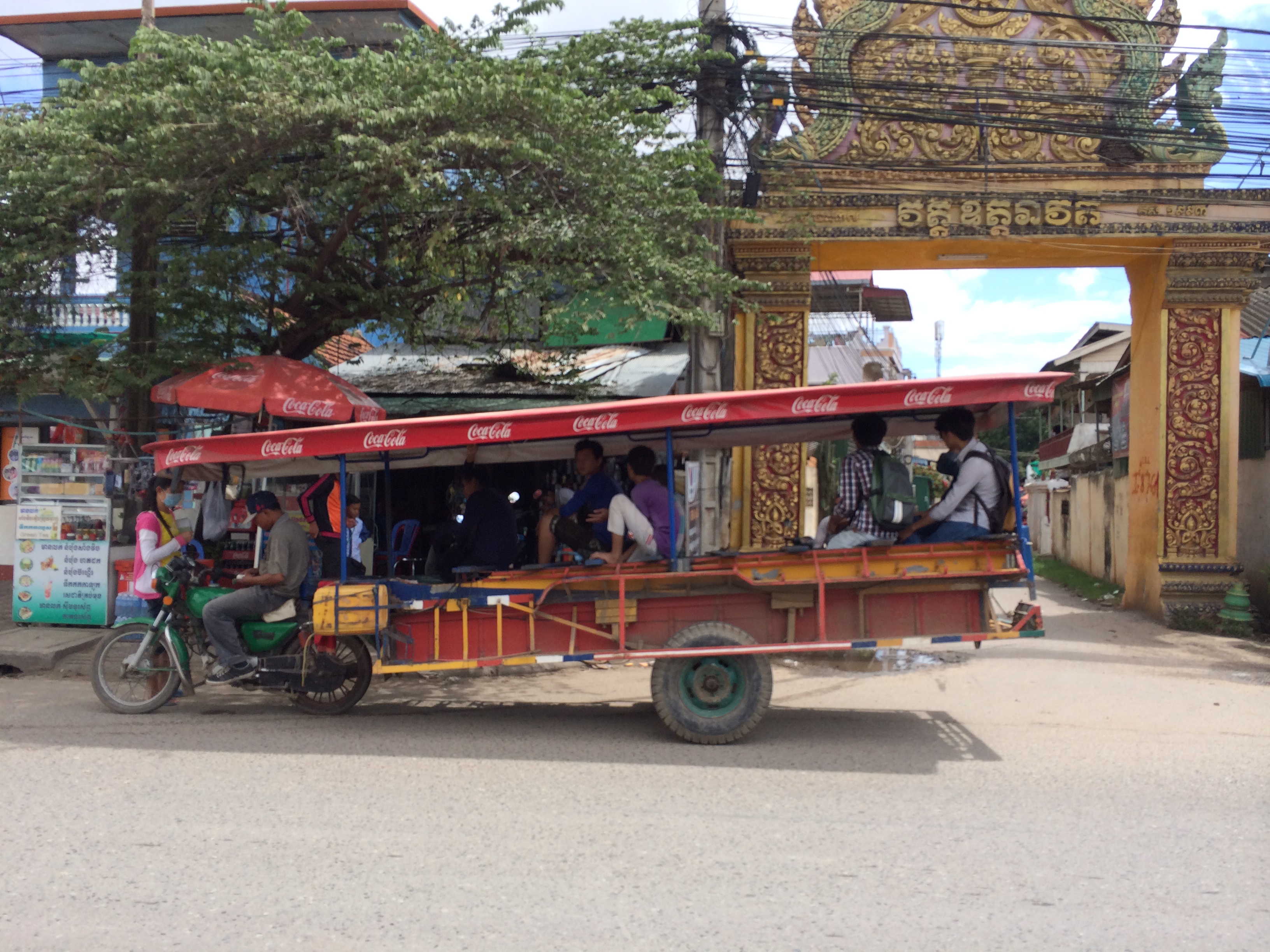Tuk tuk meets city bus