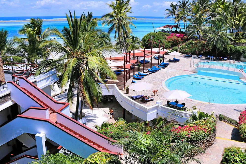 View of Voyager Resort highlighting its colorful architecture and expansive pool area.
