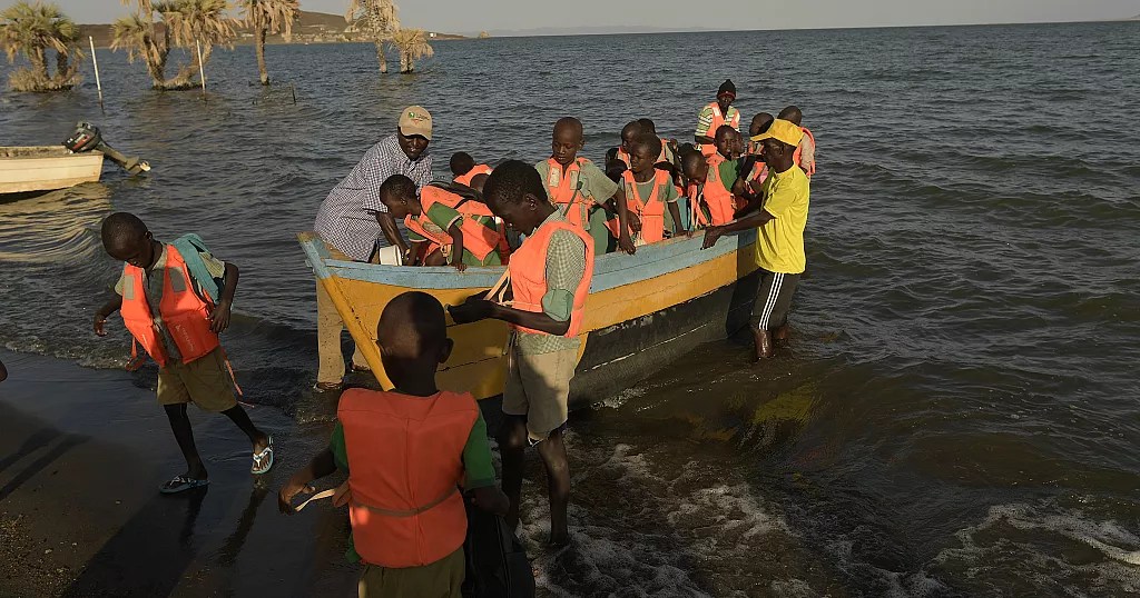 a group of children rescued in a boat in Lake Turkana