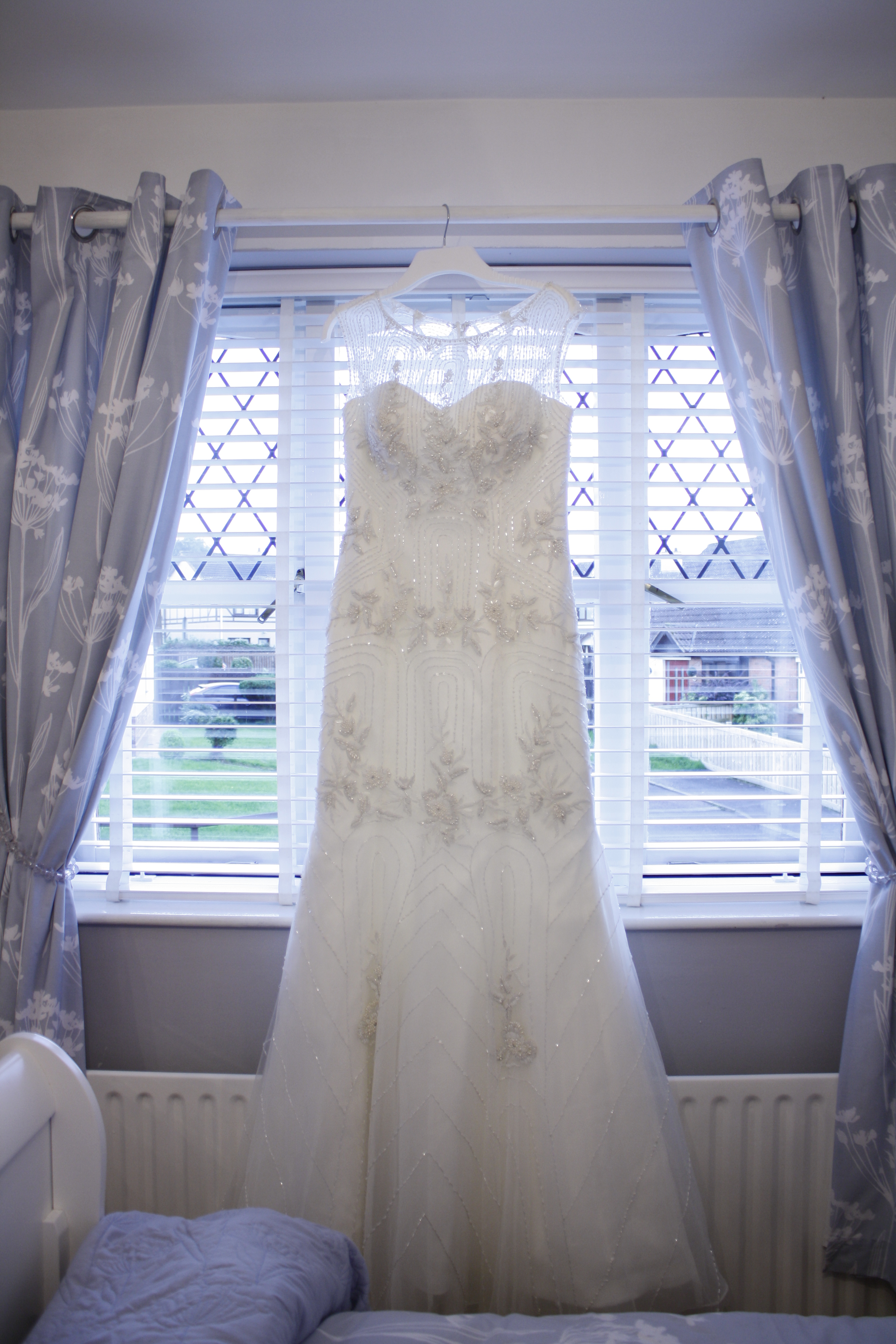 Wedding Dress detail hanging in window