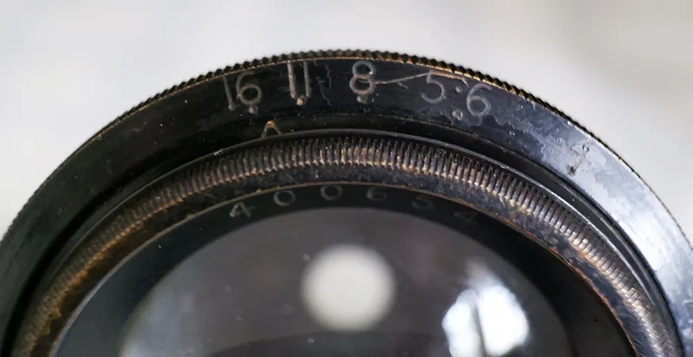 Photo of an aerial recon lens with markings '16. 11. 8. 5.6'