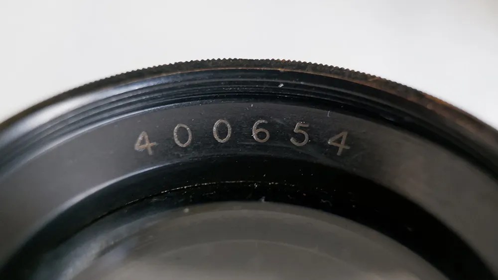 Photo of an aerial recon lens with markings '400654'