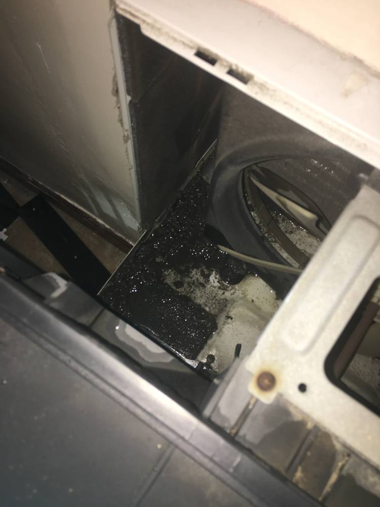 Window AC interior — July 26, 2021. Jules identifies dark spots along the fins as suspected mold