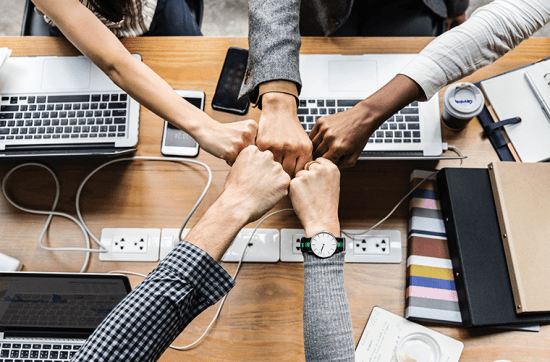 Business people hands in center
