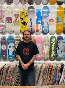 A person standing in front of a store