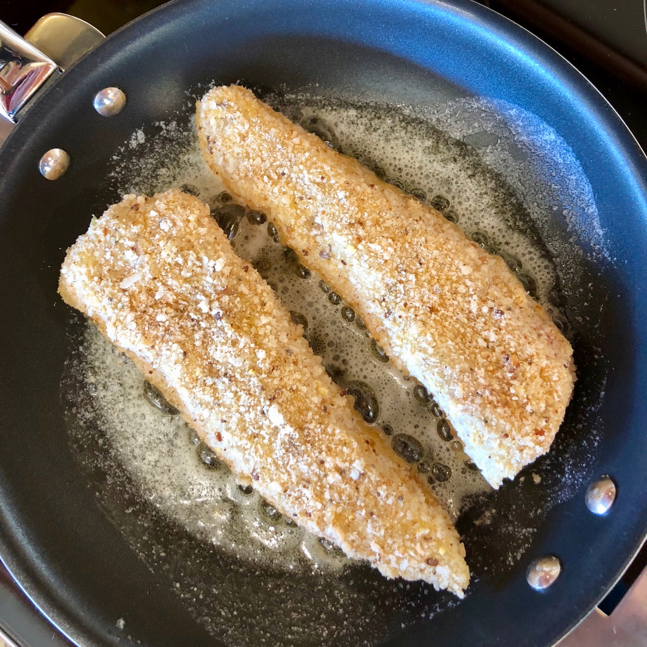 Breaded halibut in the pan