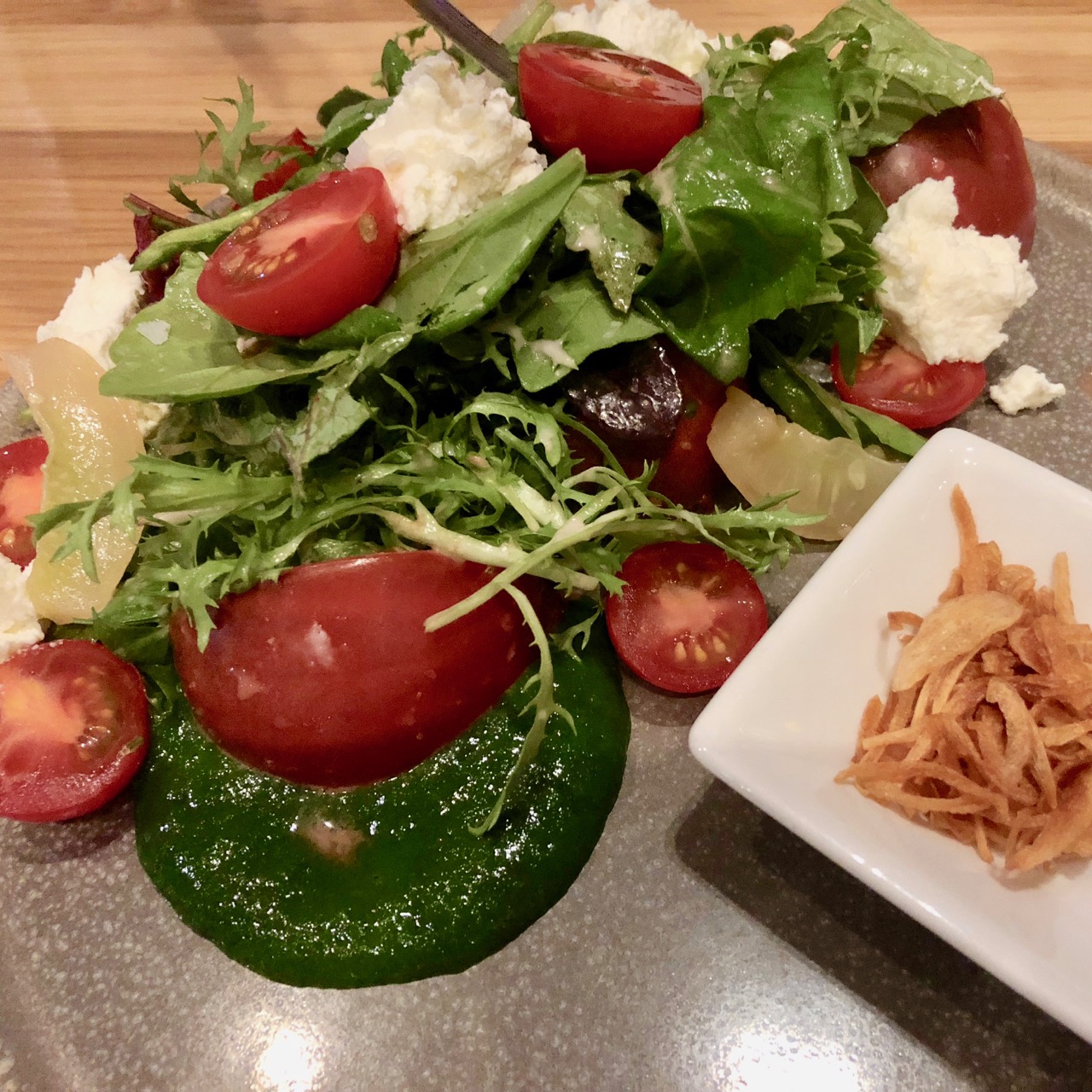 Heirloom tomato salad, nasturtium pesto, fromage frais, shallot vinaigrette and lemon cucumbers