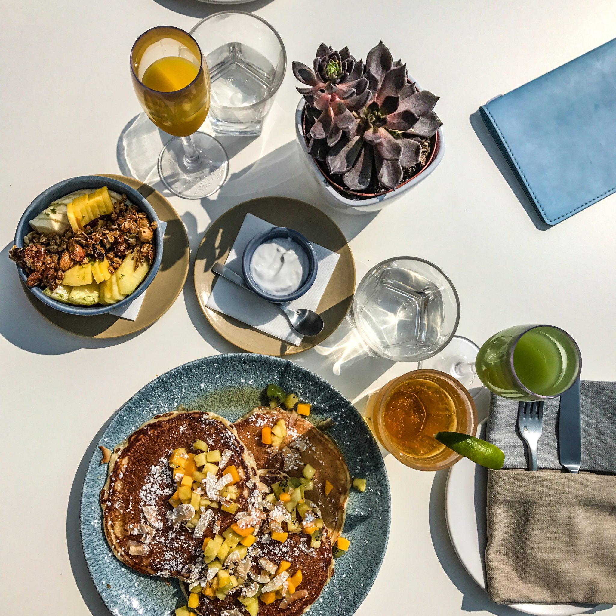 BRUNCH AT KOST - COCONUT PANCAKES, FRESH PRESSED JUICE, AND ACAI SMOOTHIE BOWL