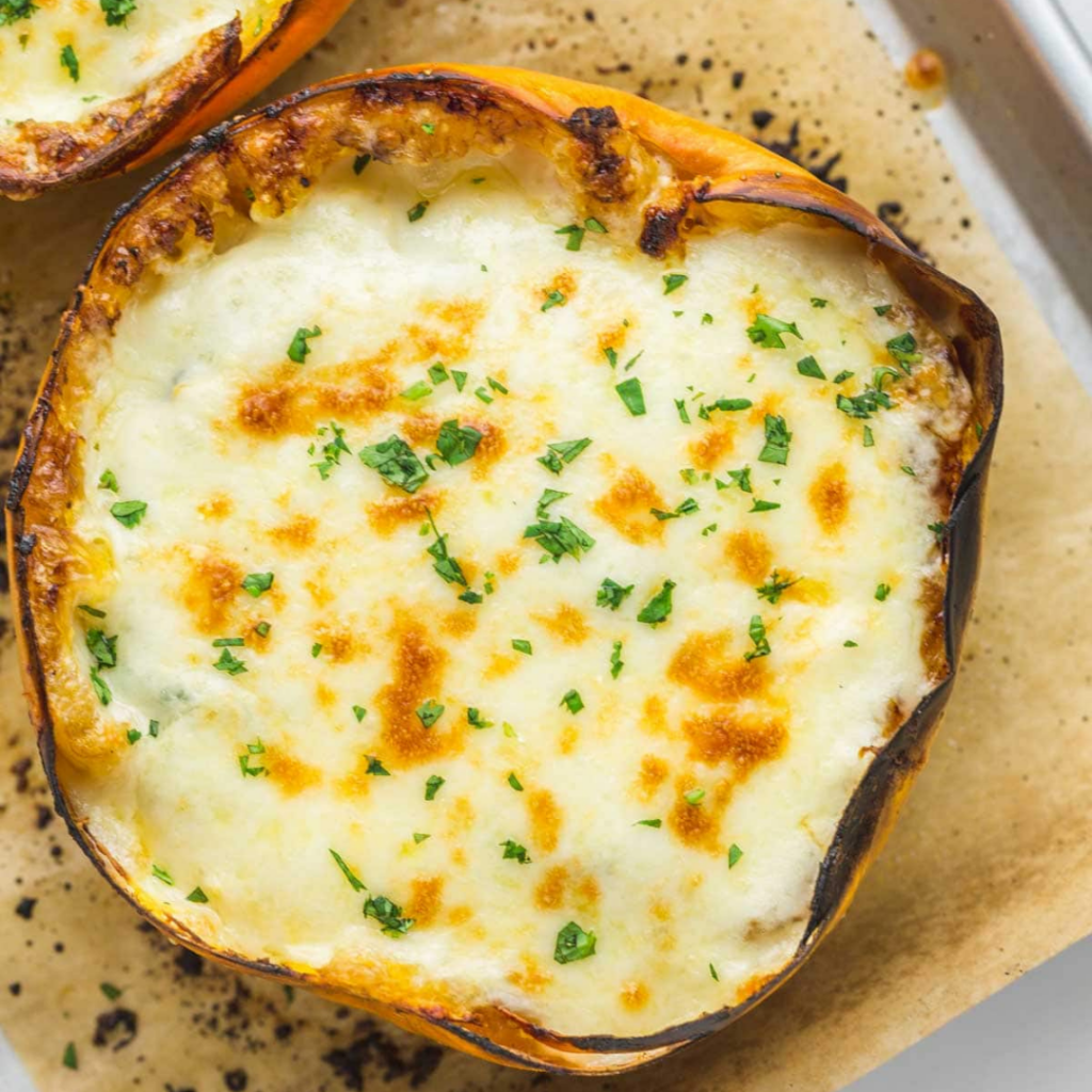 cheesy spaghetti squash boat on parchment paper