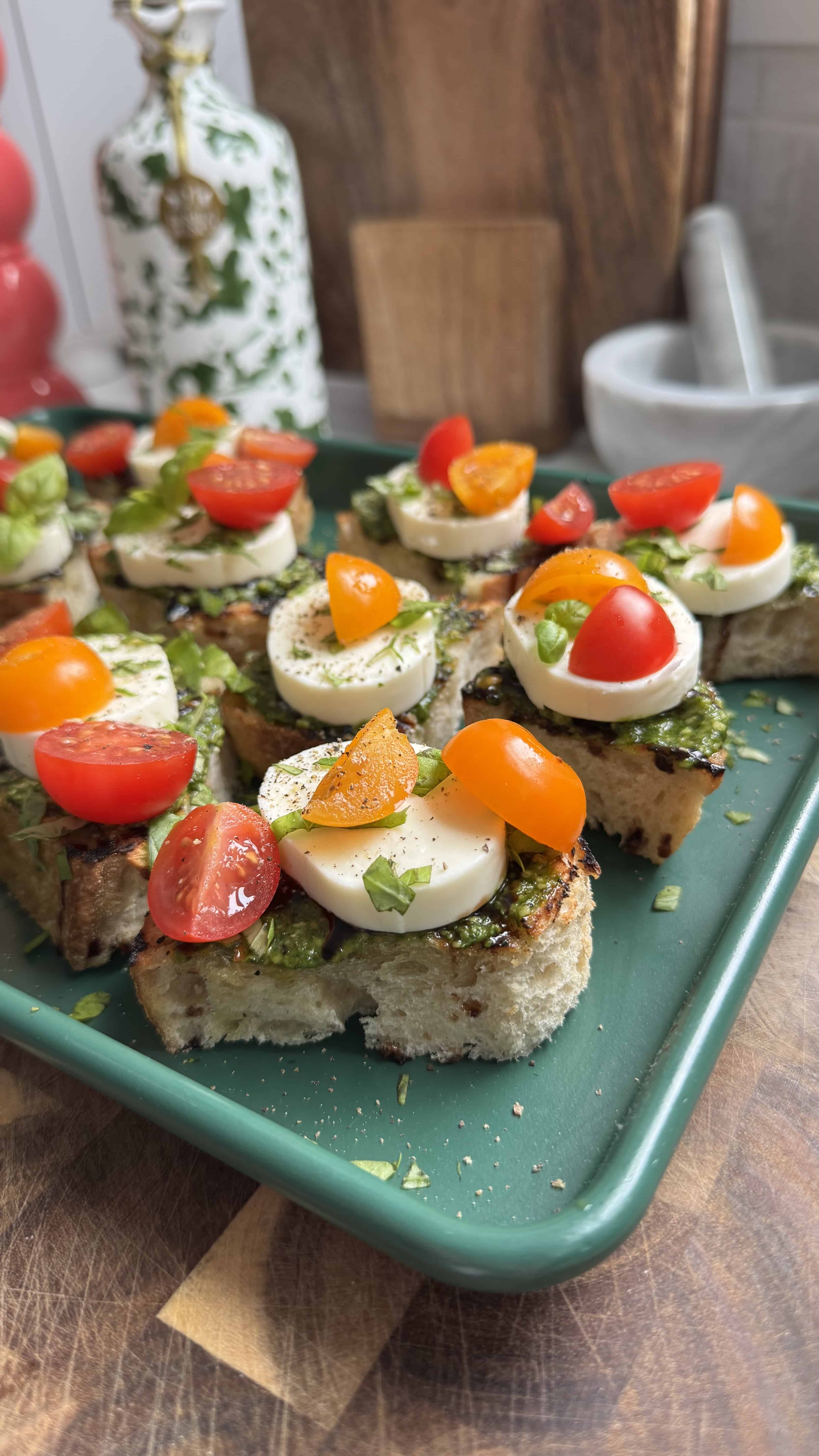 Caprese tomato toast (pesto, mozzarella, basil) &ndash; variation of tomato toast on sourdough.