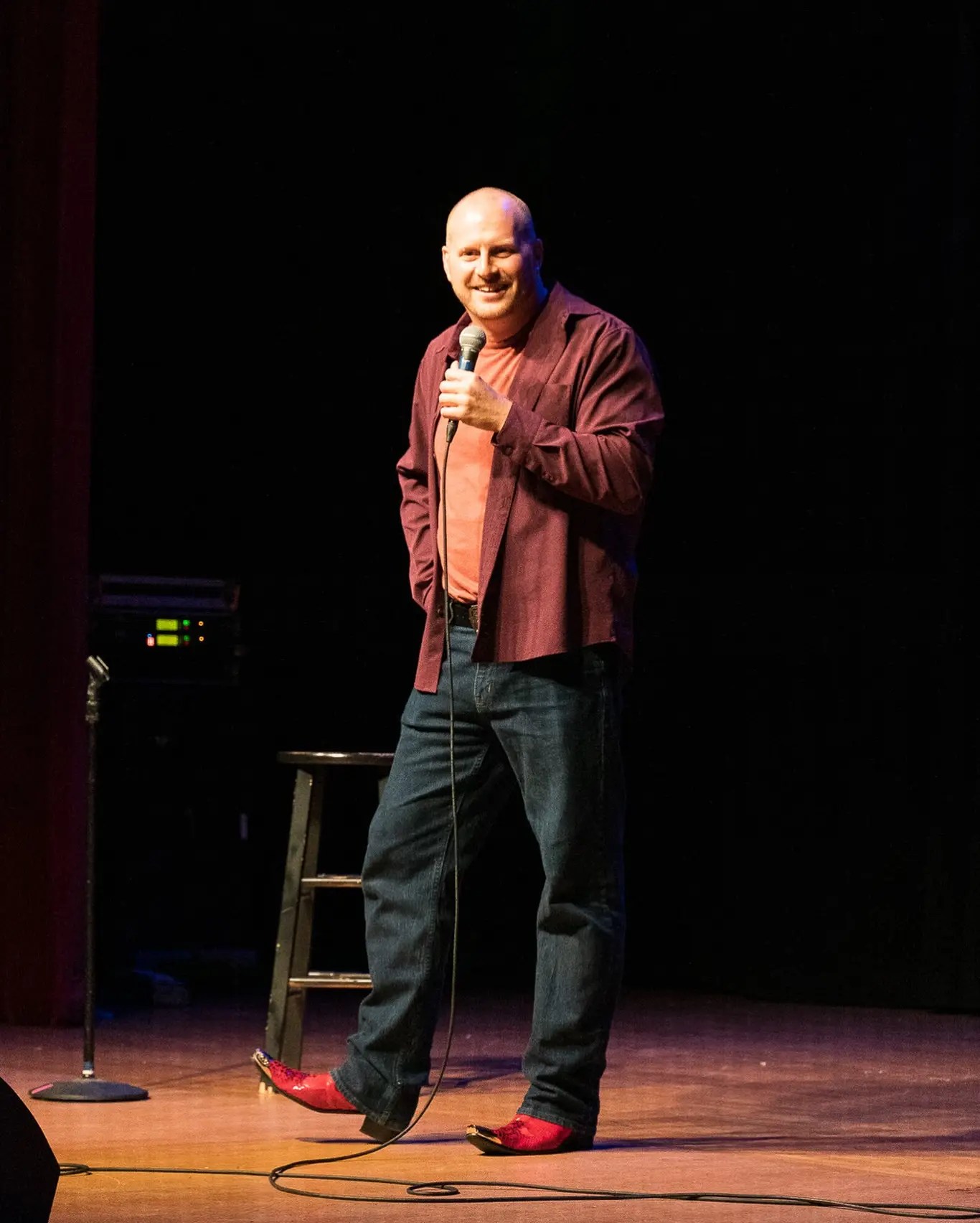 Comedian Bob Hansen performing stand-up on stage